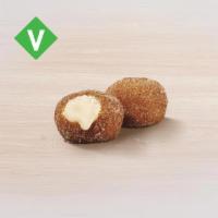 Cinnabon Delights® 2 Pack · Warm donut holes filled with Cinnabon® signature cream cheese frosting, and dusted in Makara...