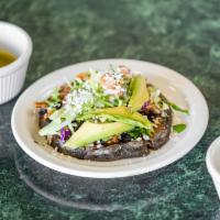 Picaditas · Handmade organic thick tortilla topped with black beans, avocado, cabbage, queso fresco, sou...