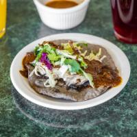 Mole Taco · Organic handmade tortilla, black beans, rice, mixteca salad, and choice of chicken, pork, or...