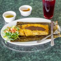 Tamal Oaxaqueno · Shredded chicken breast with our house-made mole negro wrapped in banana leaf. Mild. Gluten ...