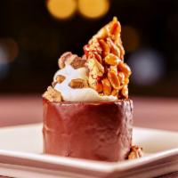 CHOCOLATE CRUNCH · Crunchy milk chocolate covered with a dark chocolate ganache, served with homemade whipped c...