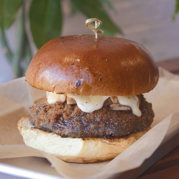 Portobello Burger · Fried Portobello mushroom, Swiss cheese, red leaf lettuce, tomato and house sauce on a soft airy potato bun.