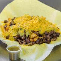 Carne Asada Fries · Served with guacamole and cheese.