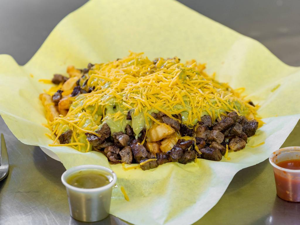Carne Asada Fries · Served with guacamole and cheese.