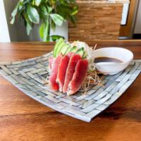 7. Bonito Tataki · Seared tuna sashimi over shredded Japanese radish, carrots, cucumber, and ponzu sauce.