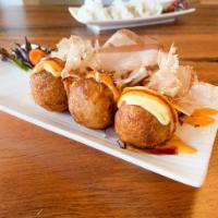 10. Takoyaki · 6 pieces. Japanese mountain potato encrusted octopus lightly fried, drizzled with eel sauce,...