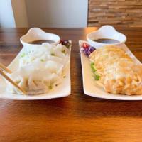 14. Gyoza · 6 pieces. Steamed or fried pork and vegetable dumplings.