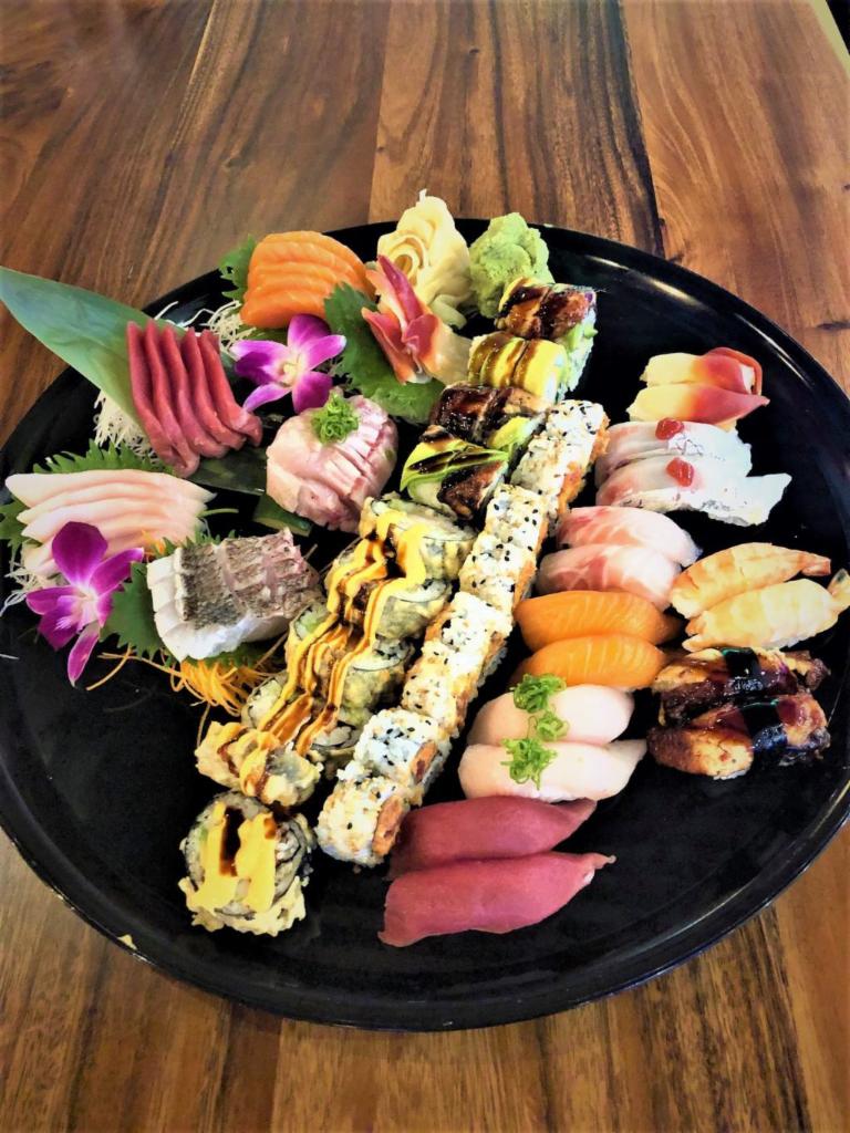 44. Koy Royalt Combo · 30 pieces sashimi (chef’s choice), 16 pieces nigiri, 8 spicy tuna rolls, 8 Dynamite rolls, and 8 Dragon rolls.