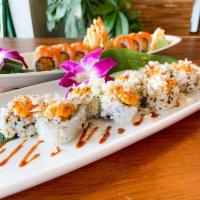 56. Volcano Roll · Whitefish, salmon, tuna, slightly toasted, and spicy sauce.