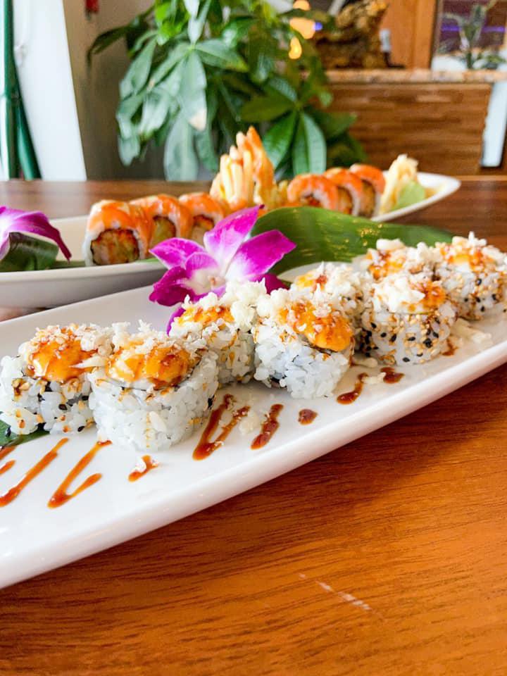 56. Volcano Roll · Whitefish, salmon, tuna, slightly toasted, and spicy sauce.