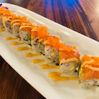 62. Tiger Roll · California roll, topped with salmon, spicy mayo, tobiko.