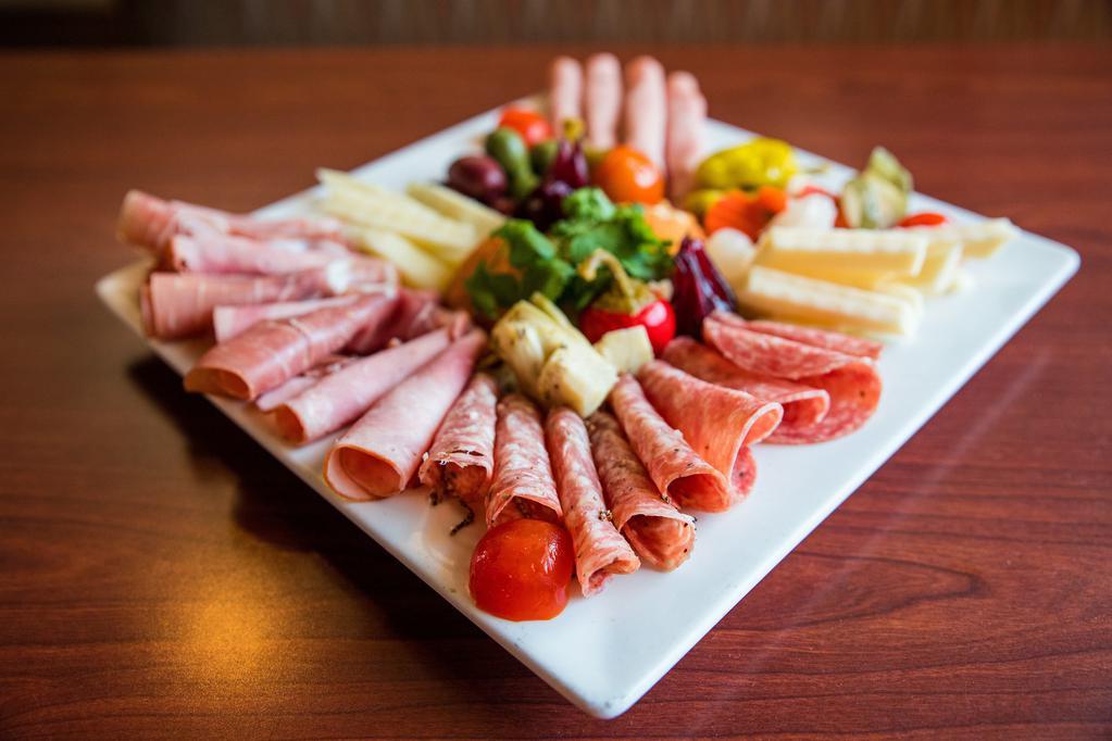 Antipasto Casareccio · A gourmet plate of an assortment of Italian cheese, cold cuts, olives, and more.