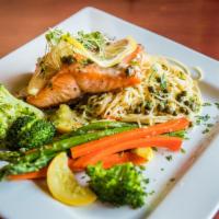 Salmon Limone  · Salmon filet with capers, white wine, and lemon sauce 