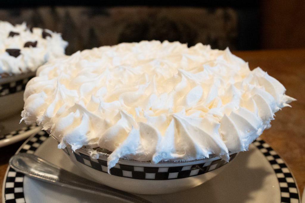 Banana Cream Pie · Banana cream layered with banana slices in a buttery graham cracker crust.  Topped with whipped cream.