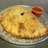 Traditional Calzone · Comes with 2 marinara sides.