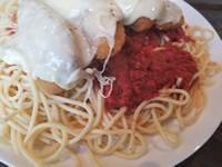 Chicken Parmesan Dinner · Lightly breaded, covered with mozzarella, and marinara sauce served on a bed of spaghetti.
