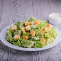 Caesar Salad · Crisp Romaine lettuce, shredded Parmesan cheese, butter garlic croutons, and our classic Cae...