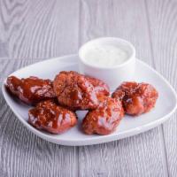 Boneless Wings · Boneless wings are tossed in flavorful sauces.