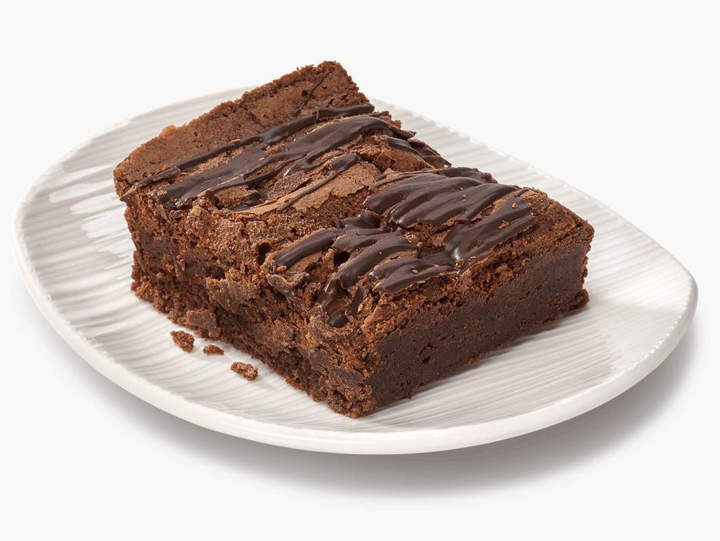 Indulgent Chocolate Brownie · Traditional chocolate decadence  with chocolate chips bits throughout and striped on top.