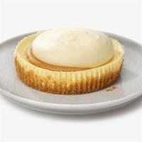 Vanilla Caramel Cheesecake for 2 · Vanilla Bean Cheesecake topped with Caramel and Crème topping.