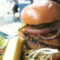 Dumont Burger · Grass fed beef, broiche bun, lettuce, tomato, red onion and house pickles. Served with choic...
