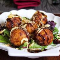 6 Pieces TakoYaki · Ball-shaped wheat flour based batter filled with diced octopus. Deep fried and topped with J...