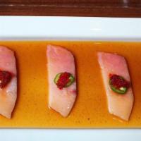 Yellowtail Ceviche · Thinly sliced yellow tail sashimi in jalapeno ponzu sauce, topped with red tobiko and jalape...