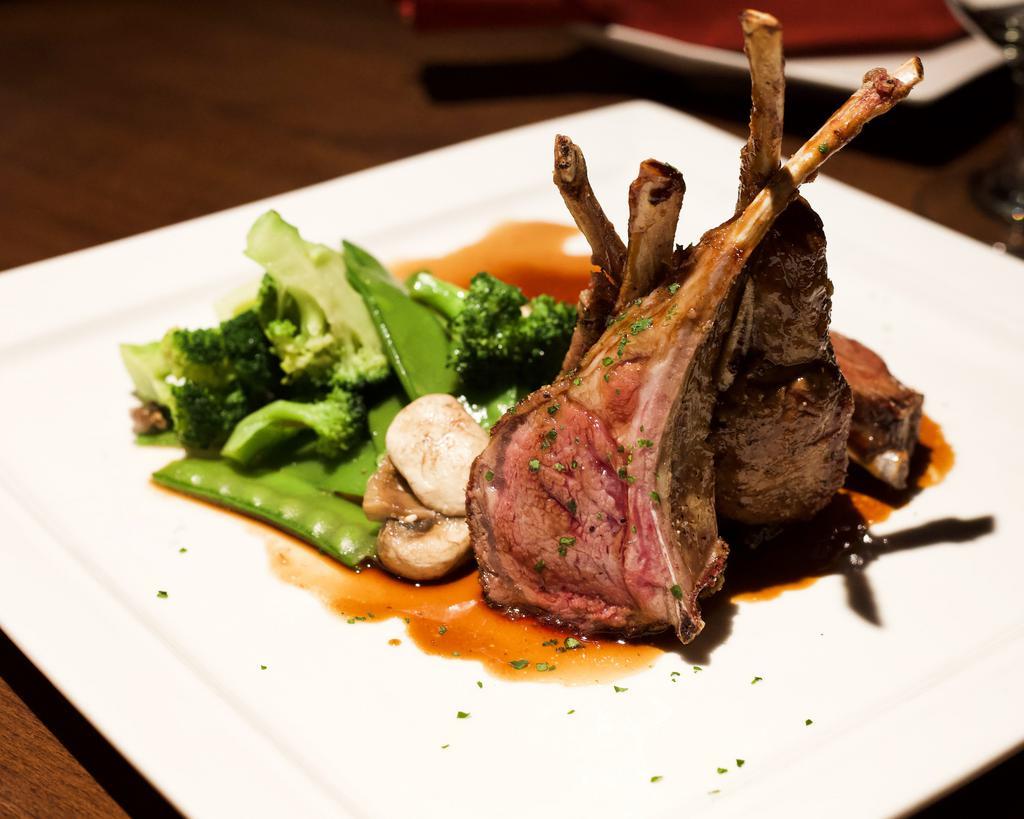 Lamb Chops · Slow roasted New Zealand lamb chops served with asparagus, broccolini and chef's steak sauce. Served with choice of side.