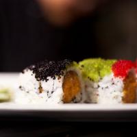 Electric Shock Roll · Spicy salmon, tempura crunch, topped with multiple colors of tobiko.