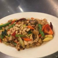 Chicken Kung Pao · Golden peanuts, water chestnuts, baby corn, carrots, green onion served with spicy kung pao.