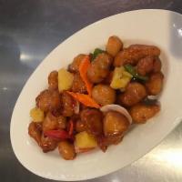 Chicken Sweet and Sour · Crispy chicken served with pineapple in a golden sweet and sour sauce.