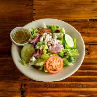 Greek Salad · Romaine lettuce, tomatoes, onions, cucumbers, Kalamata olives, feta cheese and finished with...