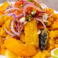 JALEA · Deep fried fish, shrimp, mussels and calamari served with fried yuca and salsa criolla.