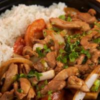 POLLO SALTADO · Peruvian Stir-Fried Sautéed chicken, tomatoes and onions, served with fries & white rice.