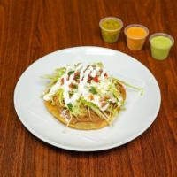 Tostada · 1 piece. A crispy tortilla topped with refried beans, choice of meat, lettuce, pico de gallo...