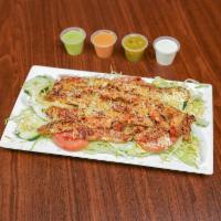 Chicken Salad · Ensalada de pollo. Chicken salad grilled chicken with lettuce, cucumber, onion, tomatoes, an...