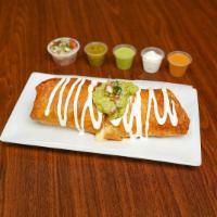Steak Chimichanga · Carne asada. Flour tortilla filled with rice, refried beans, your choice of meat, and mozzar...