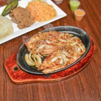 Grilled Chicken Breast Platter · Pechuga de pollo a la plancha. Served with rice, beans, and tortillas.