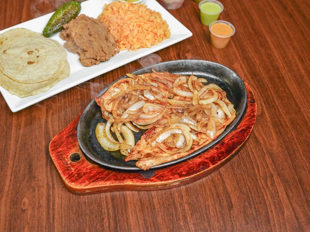 Grilled Chicken Breast Platter · Pechuga de pollo a la plancha. Served with rice, beans, and tortillas.