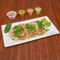 TACOS · (3) Hand made soft corn tortillas with your choice of meat 