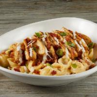 CHICKEN BACON RANCH MAC & CHEESE · Grilled chicken breast, crisp bacon pieces, creamy cheddar, Parmesan and Monterey Jack chees...