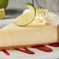 KEY LIME PIE · Graham cracker crust, fresh lime and garnished with raspberry puree.
