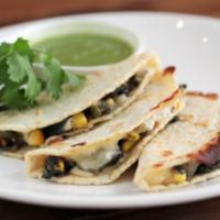Josefina's Quesadilla · House-made corn tortillas filled with huitlacoche and Chihuahua cheese. Served with salsa ve...