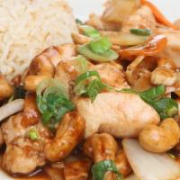 Cashew Chicken Combo · Tender chicken, breast with celery, carrots, zucchini and water chestnuts in brown sauce top...