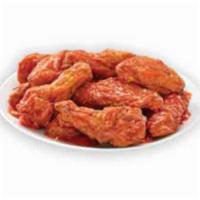 Hot Buffalo Bone-In Wings · Our traditional bone-in wings oven roasted, and then tossed in hot buffalo sauce. For those ...