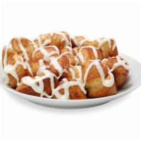 Cinnamon Swirl Monkey Bread · Bite-sized pieces of freshly made dough, sprinkled with cinnamon and sugar, then baked and c...