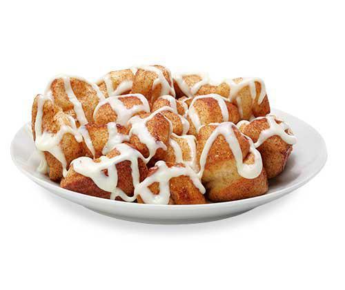 Cinnamon Swirl Monkey Bread · Bite-sized pieces of freshly made dough, sprinkled with cinnamon and sugar, then baked and covered in cream cheese icing.