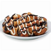 Chocolate and Cream Monkey Bread · Bite-sized pieces of freshly made dough, sprinkled with cinnamon and sugar, then baked and d...