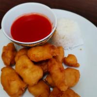 L11. Sweet and Sour Chicken · Served with your choice of white or fried rice and an egg roll.
