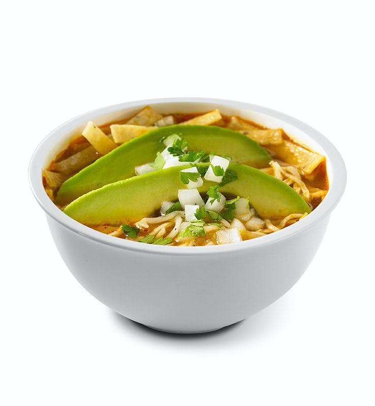 Chicken Tortilla Soup · Roasted tomato and tortilla soup with fire-grilled all white meat chicken, topped with fresh sliced avocado, Jack cheese, fresh onions, cilantro & tortilla strips.